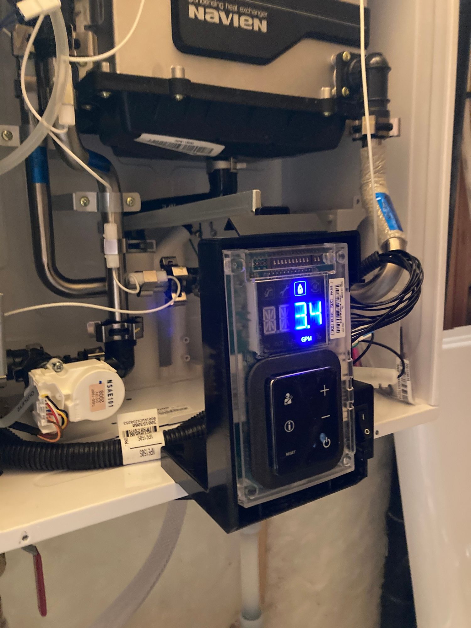 the inside of a navien water heater with a digital display