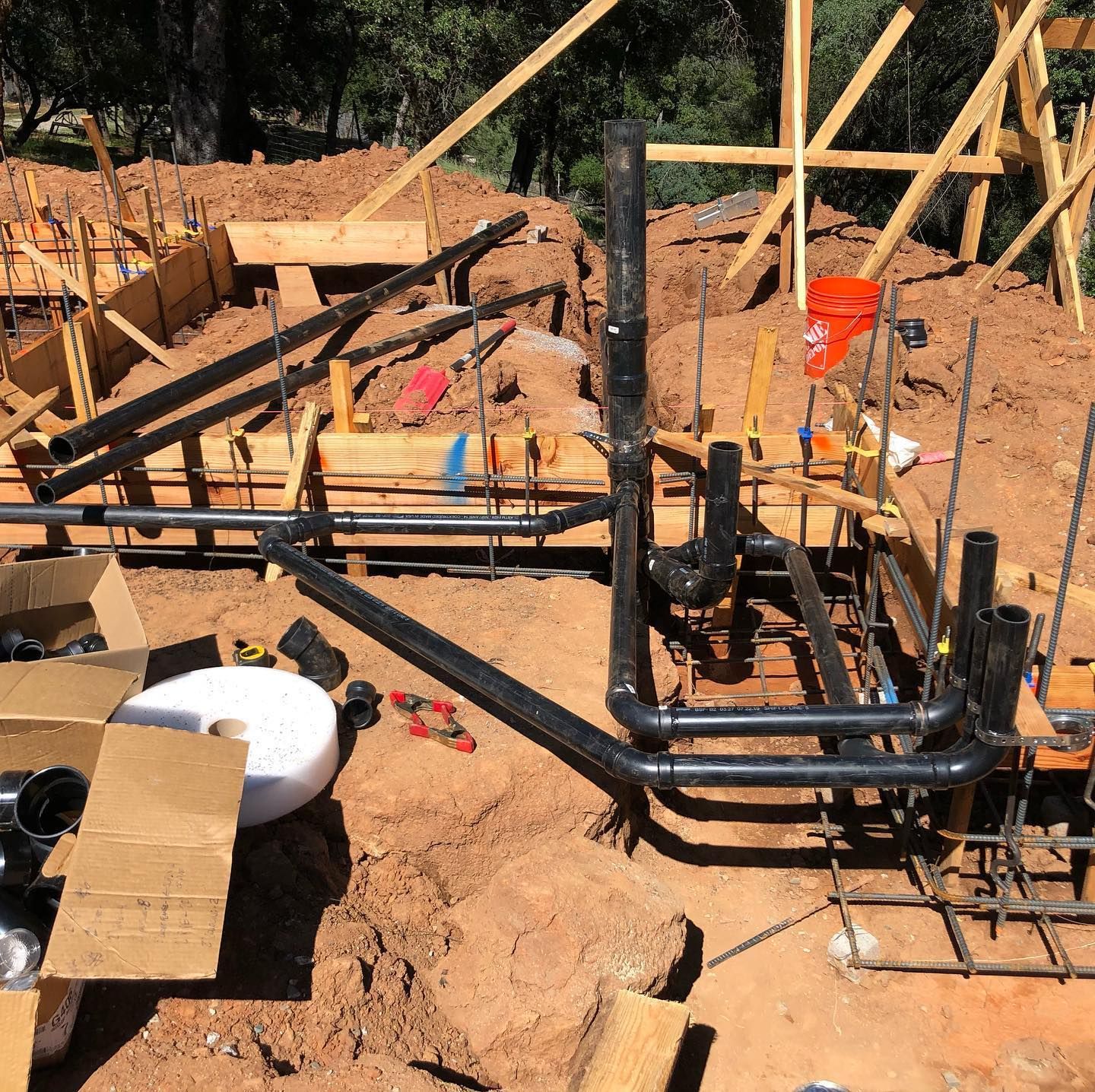 a construction site with a lot of pipes and boxes