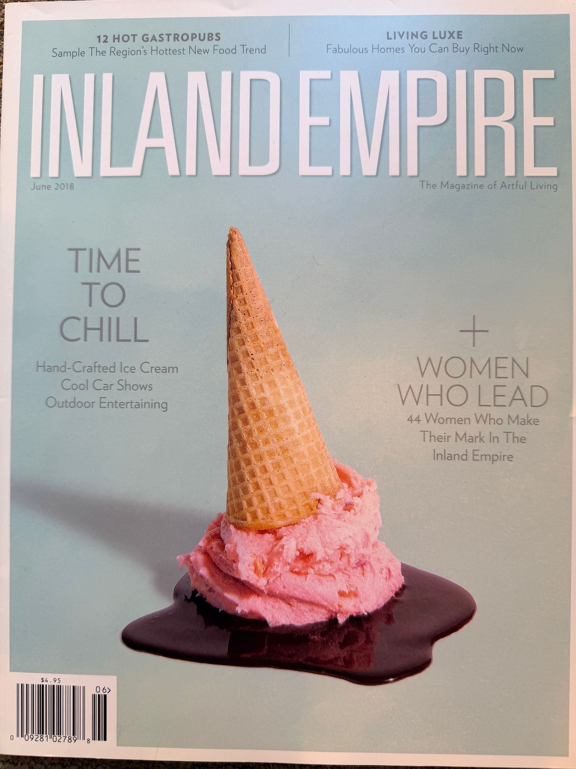 Inland Empire magazine cover with pink ice cream in a cone on a purple puddle against a pale blue background