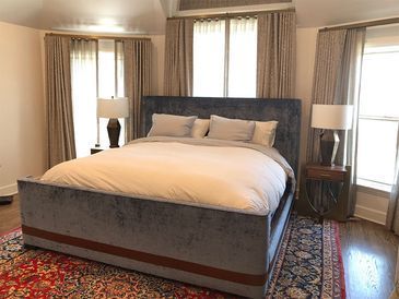 There is a large bed in the middle of the room.