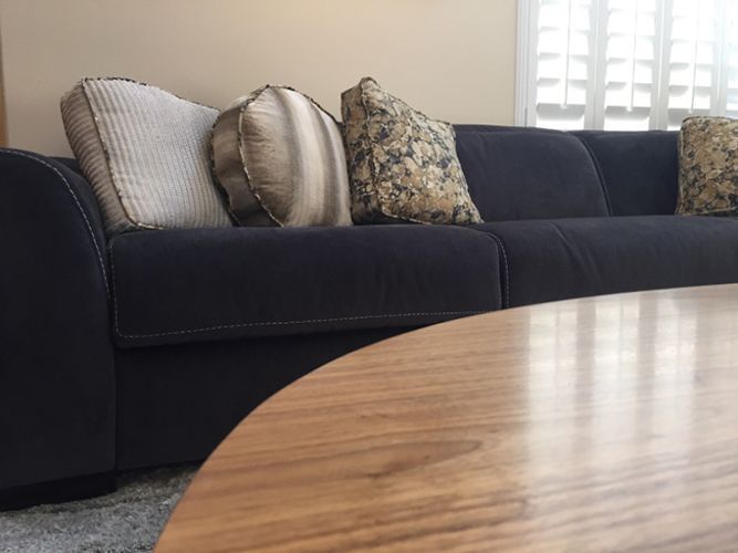 A living room with a couch and a coffee table.