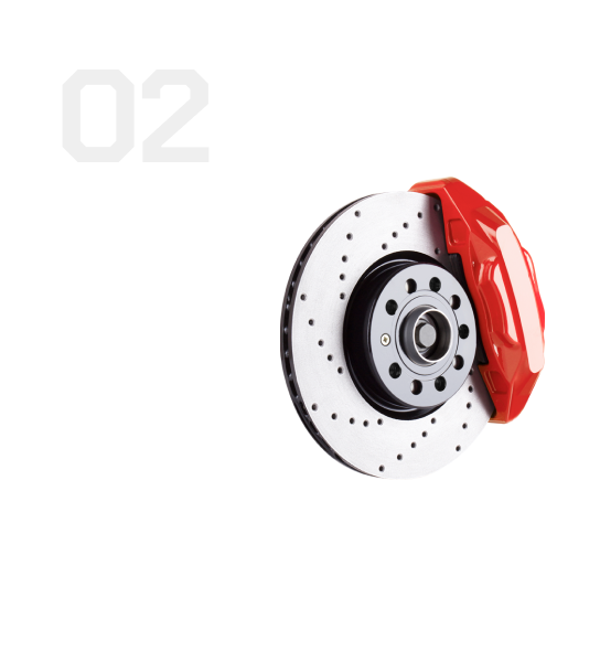 Red brake caliper and perforated brake rotor on a white background | Universal Auto Repair