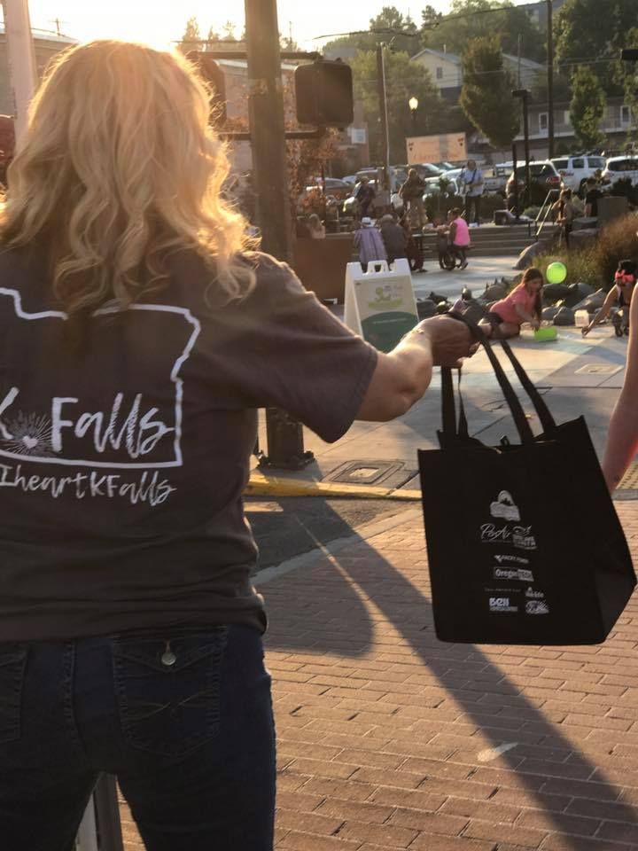 A woman wearing a shirt that says falls on it