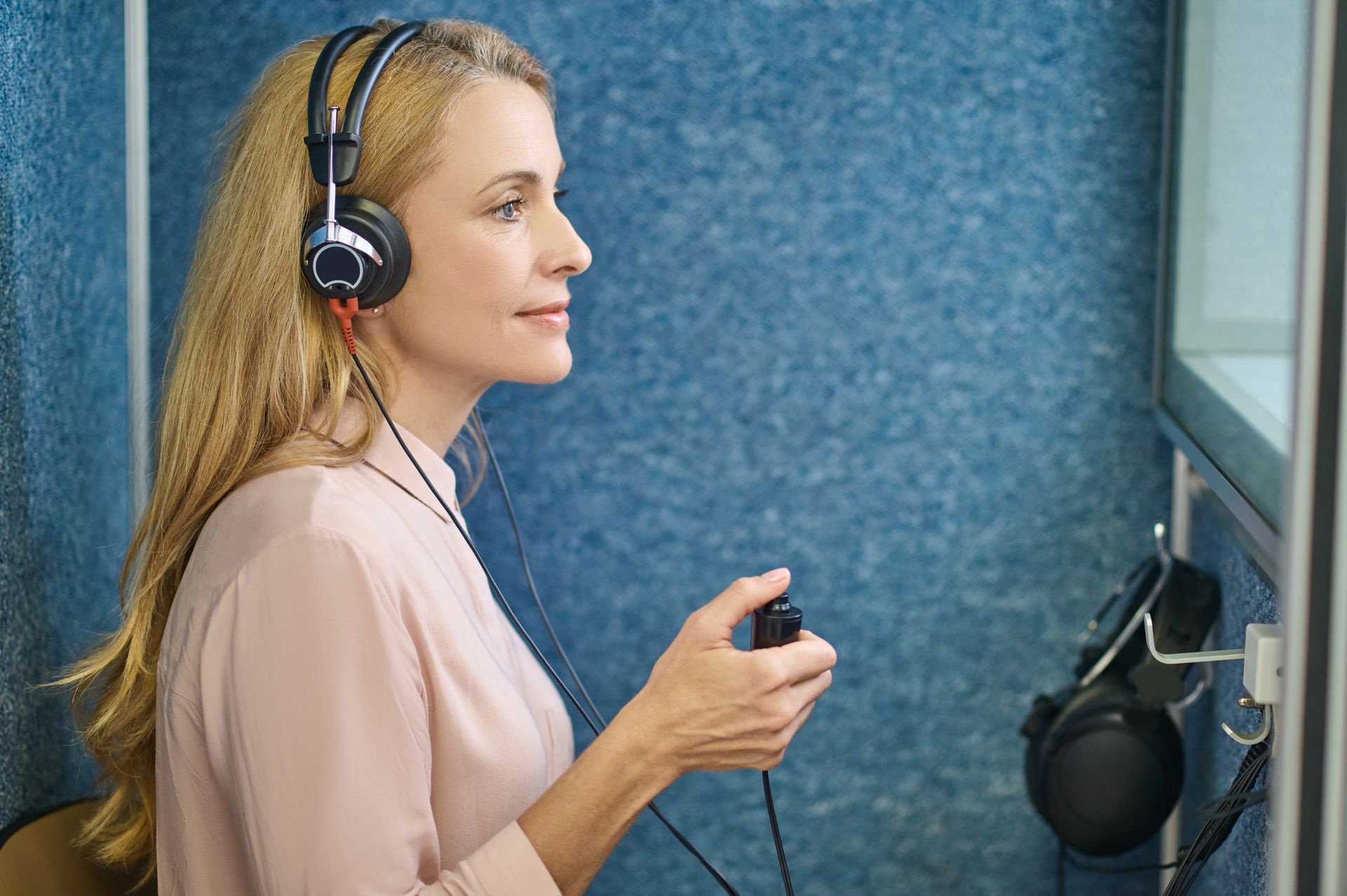A woman is undergoing a hearing test.