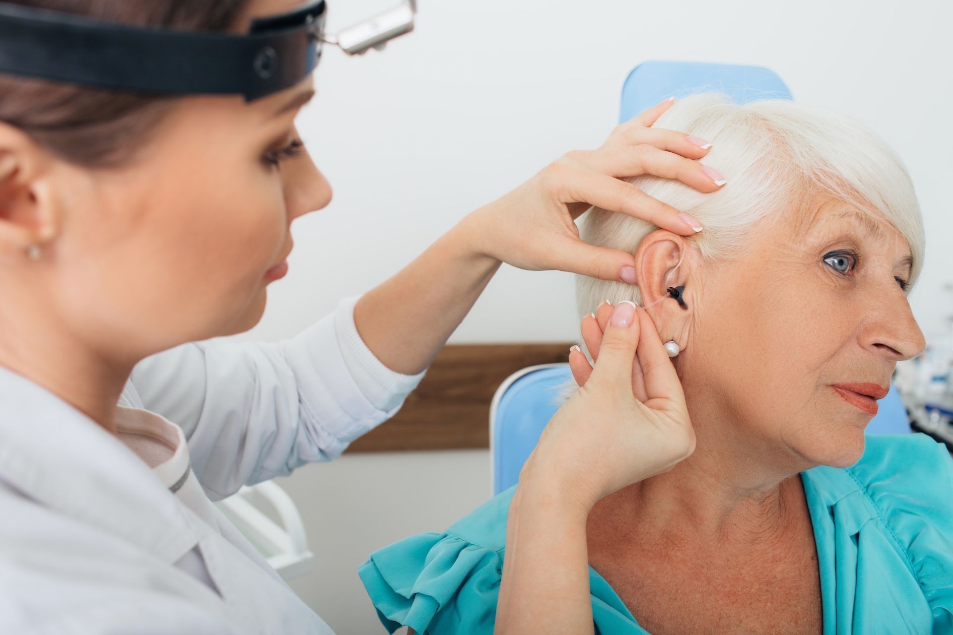A doctor checking an old person's ear | Hearing Exams in Lake Mary, FL