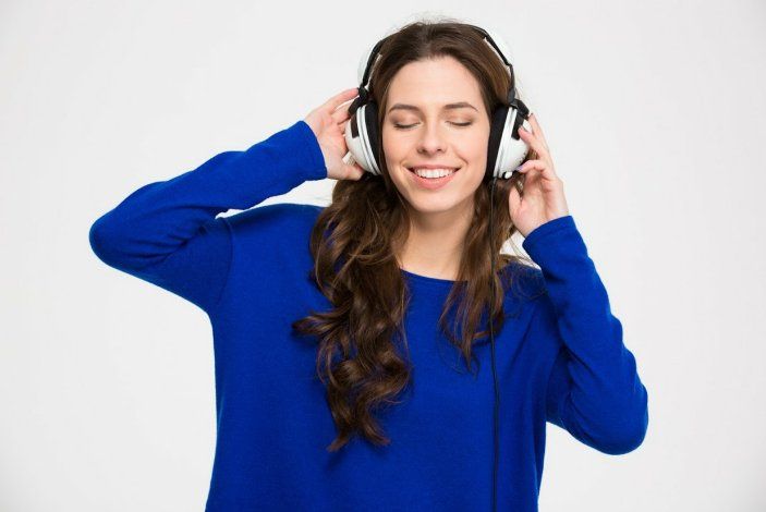 Woman Using Headphone — Sanford FL — Accurate Heating Technology Inc