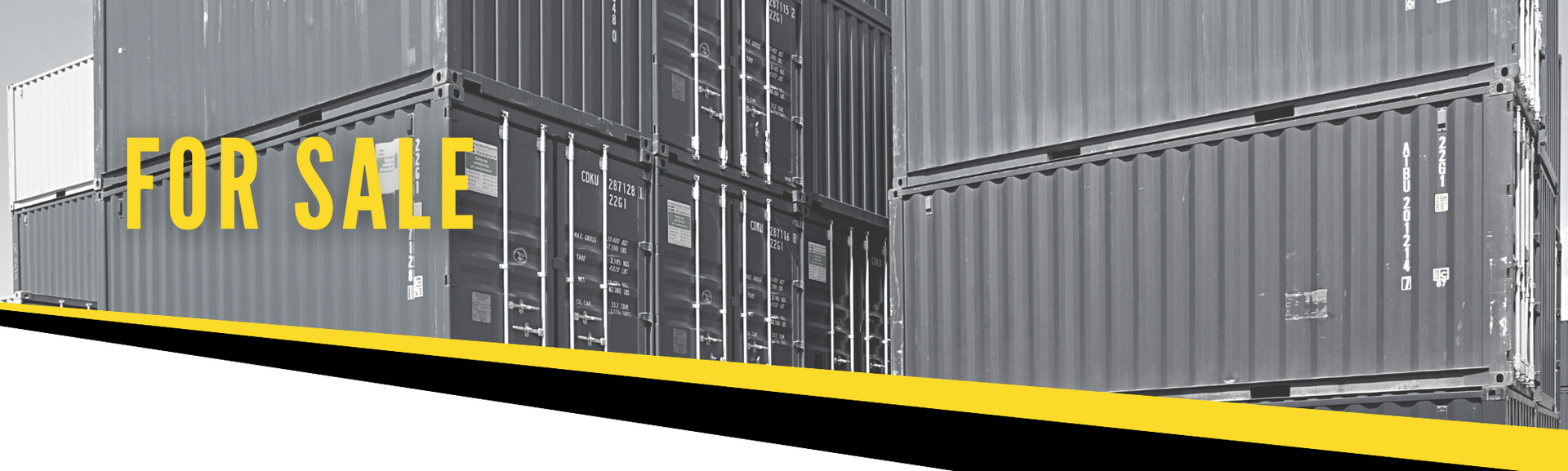 Stacked grey shipping containers with the words