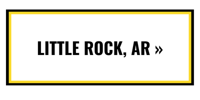A rectangular button with a yellow border and black text that reads 