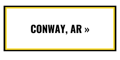 A rectangular button with a black border, yellow inner frame, and the black text 