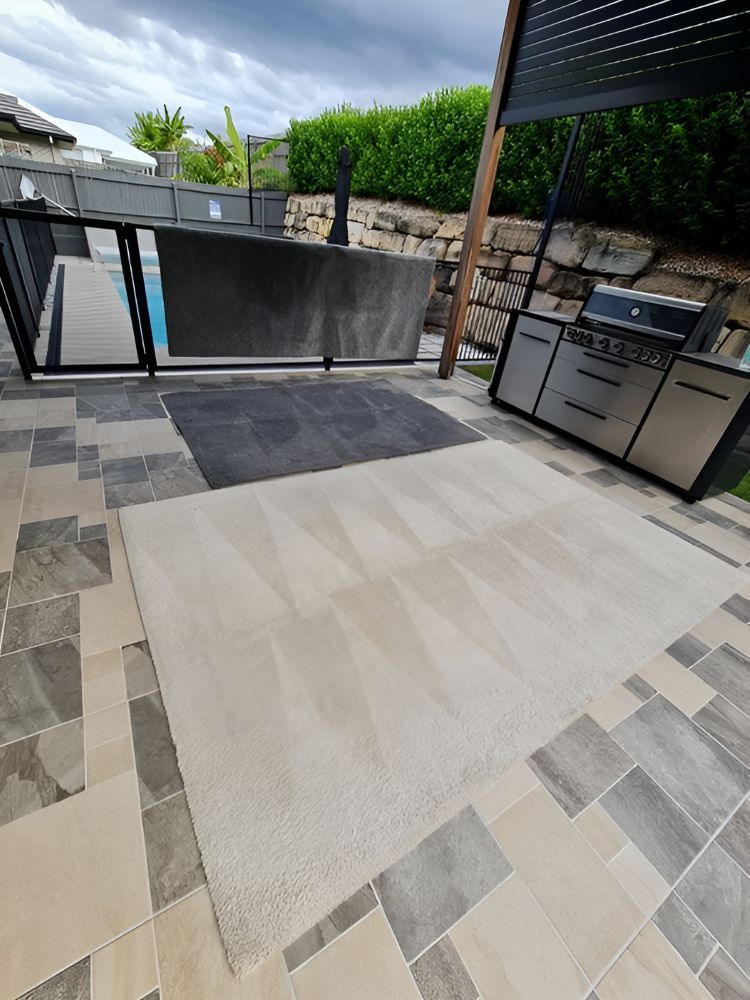 A Patio With A Grill And A Pool In The Background — A1 Cleaner Carpets N Homecare In Ravenshoe, QLD
