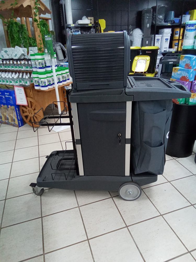 A Black Cart Is Sitting On A Tiled Floor In A Store — A1 Cleaner Carpets N Homecare In Millaa Millaa, QLD