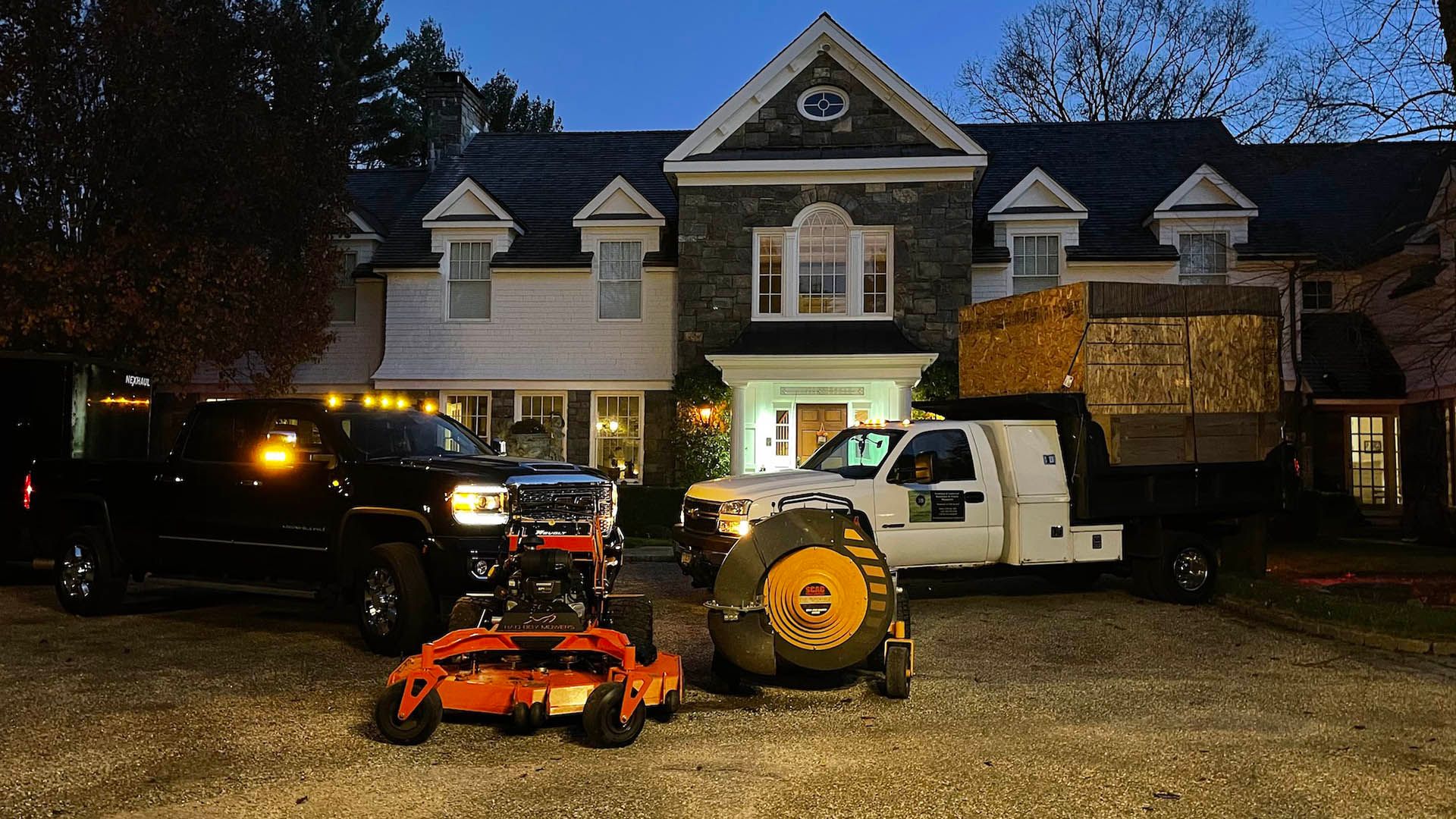 A house with a lot of vehicles parked in front of it