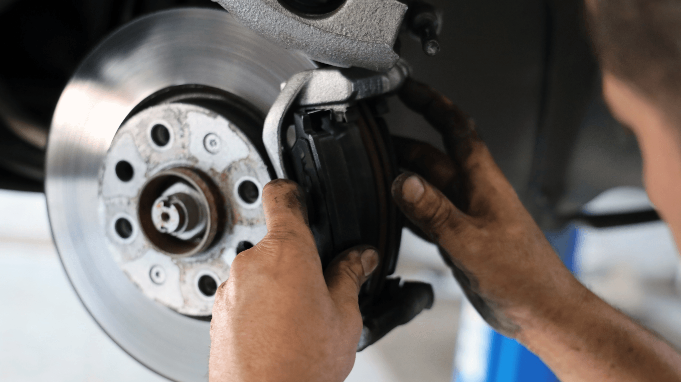 A mechanic performing a brake service. 
