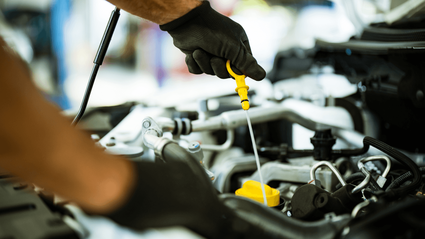 A mechanic doing an oil change. 