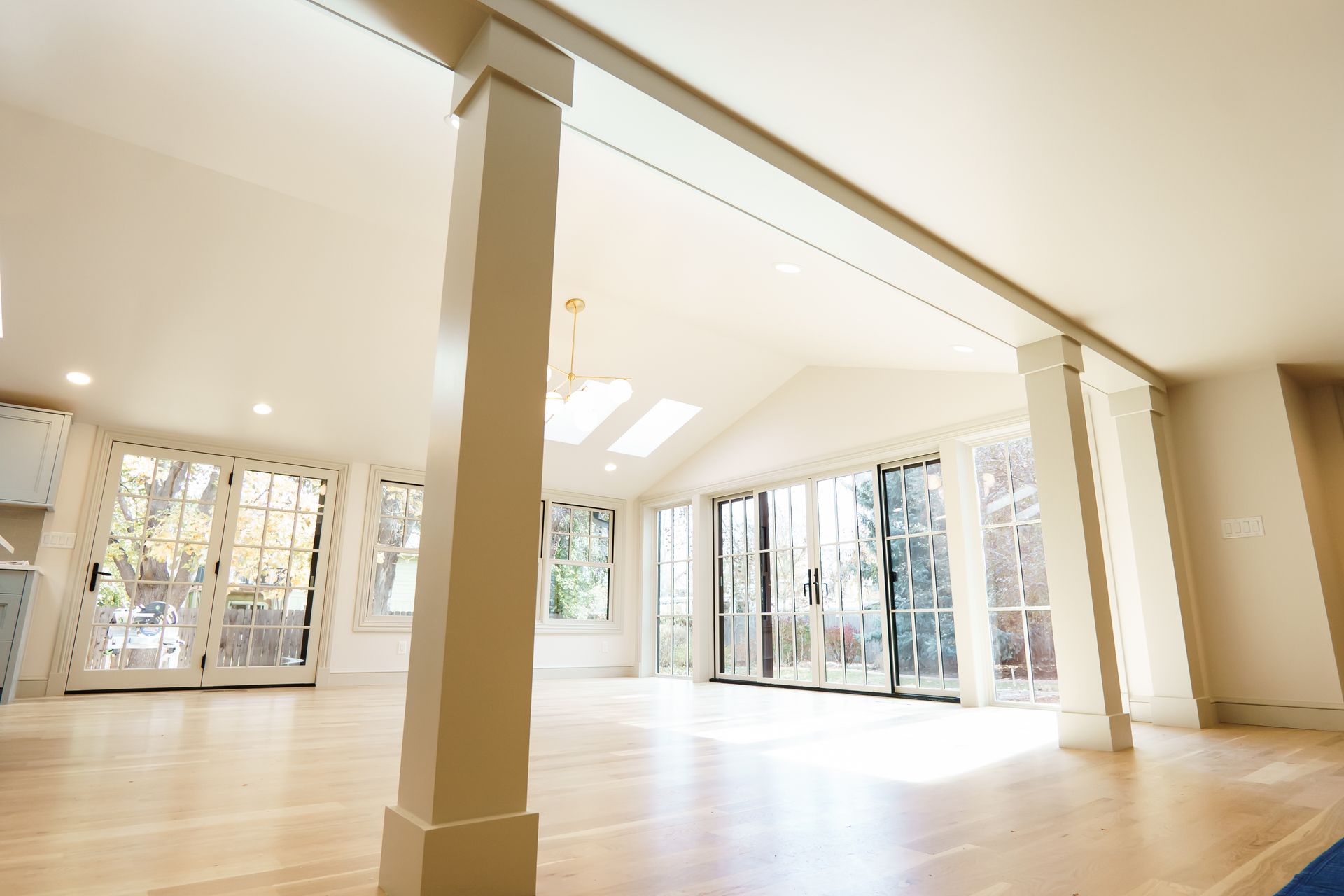 A large empty room with a lot of windows