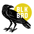 A black bird is standing next to a yellow circle that says blk brd