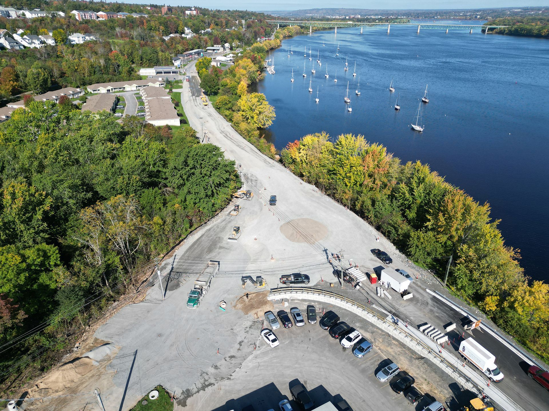 An aerial view of a parking lot next to a river