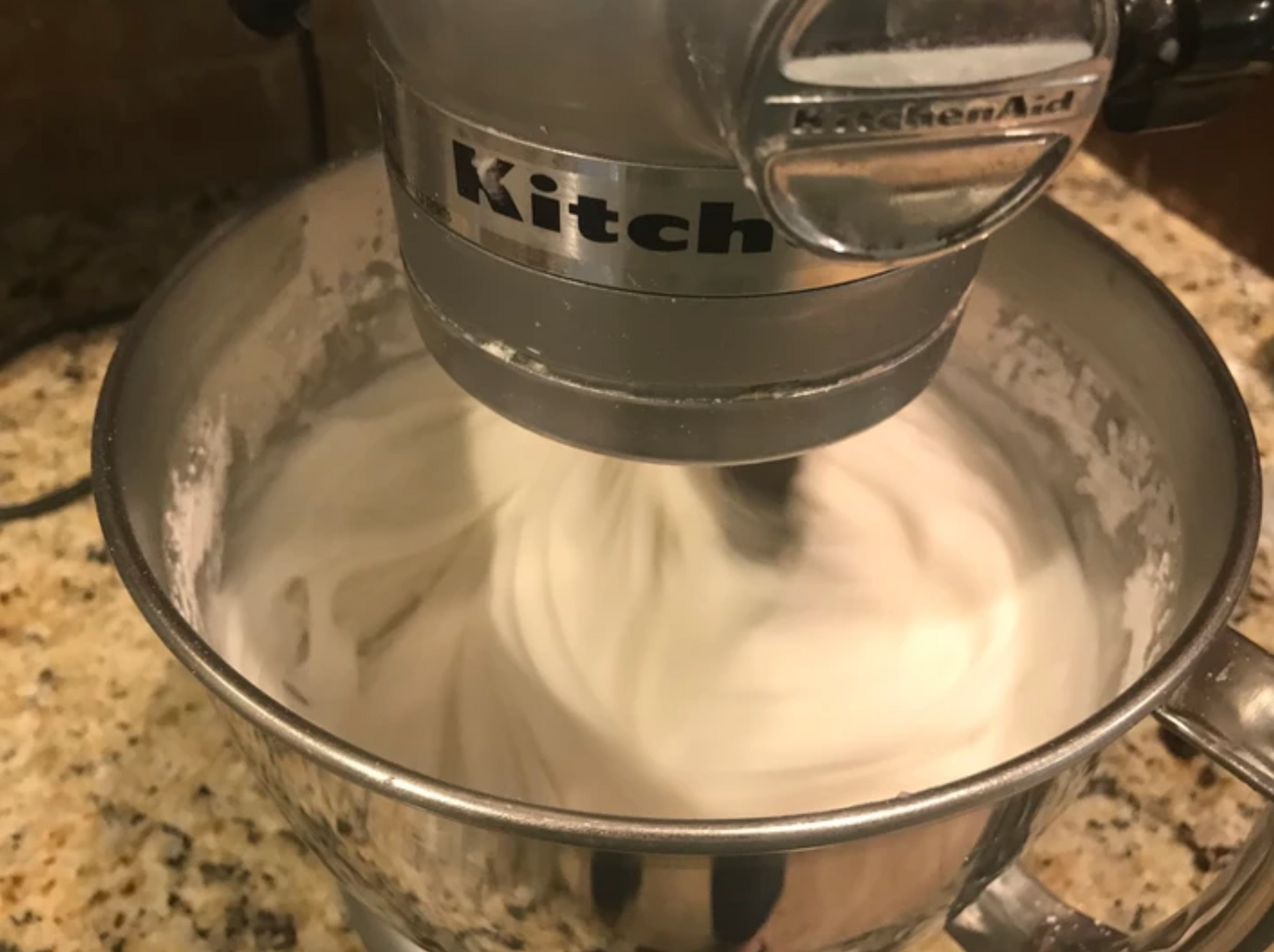 mixing frosting in a mixer