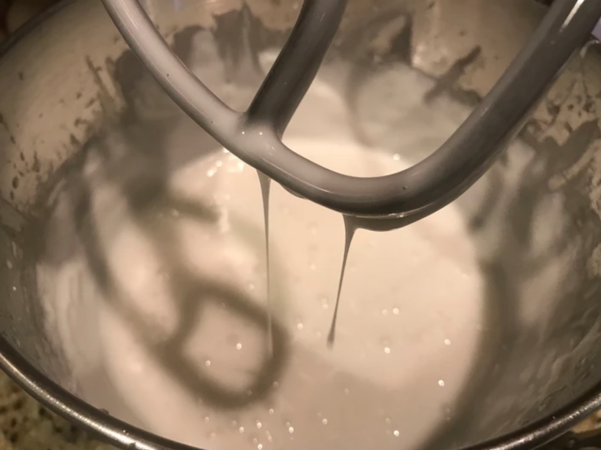 mixing frosting in a mixer