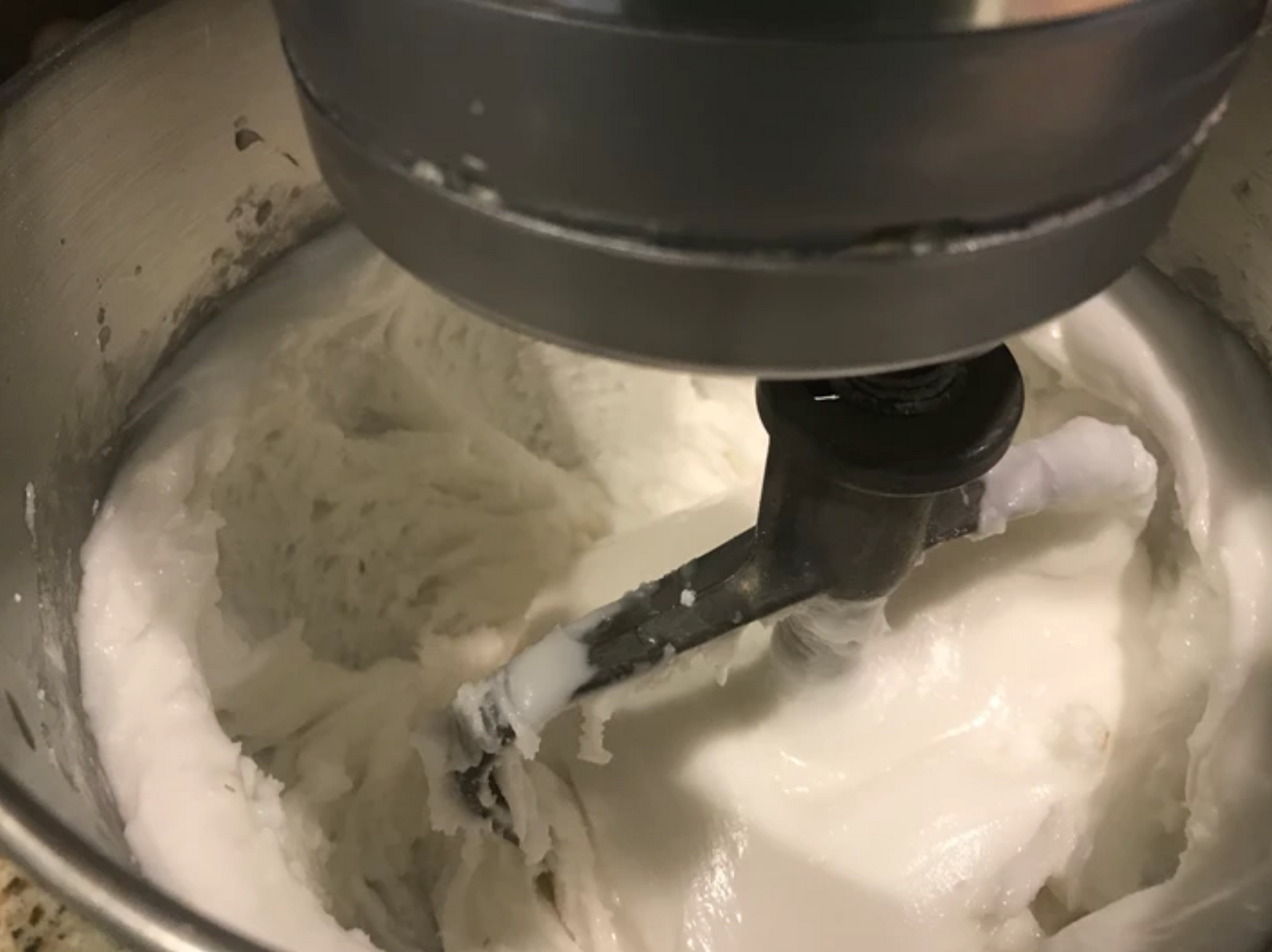 mixing frosting in a mixer