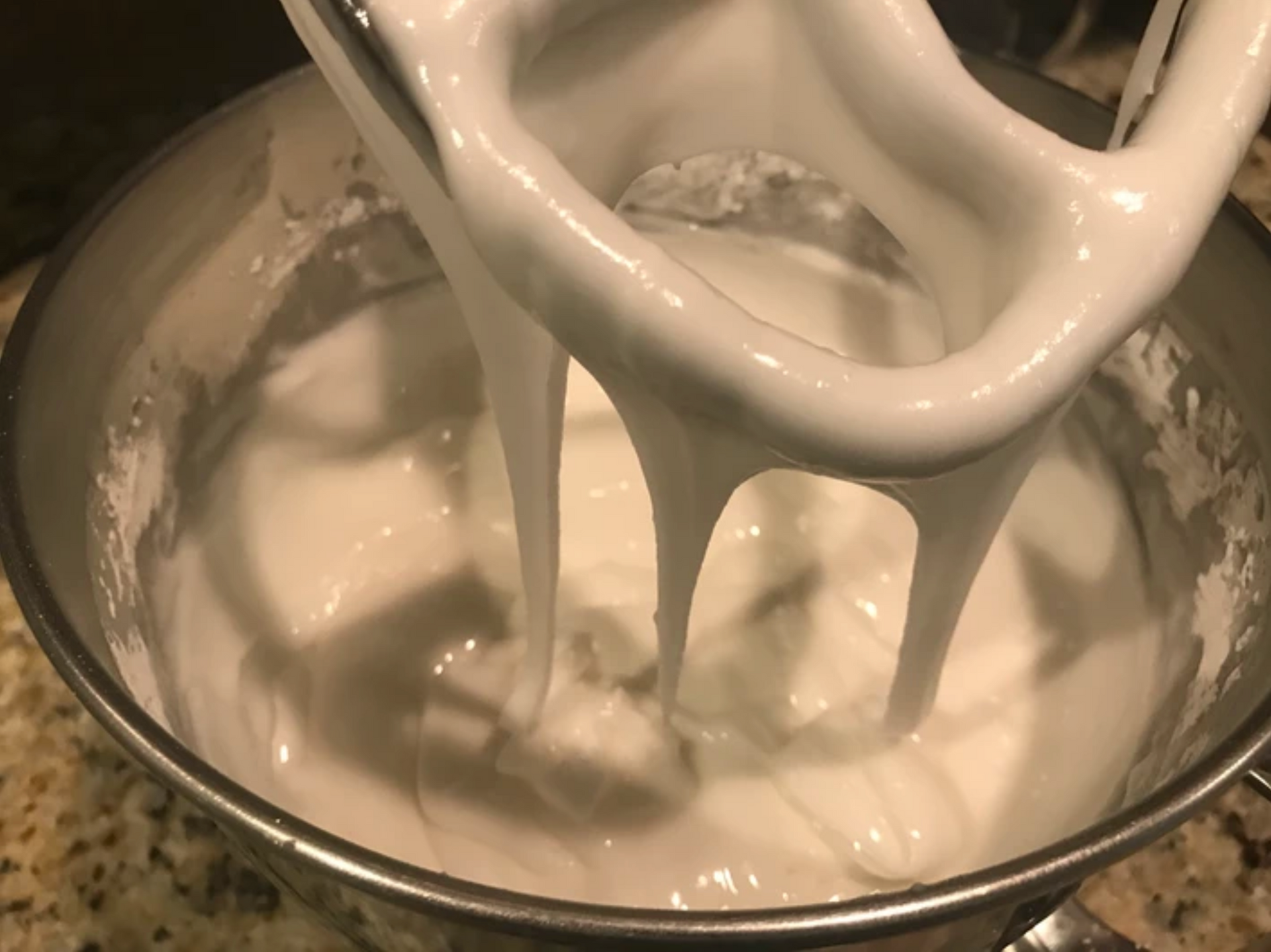 mixing frosting in a mixer