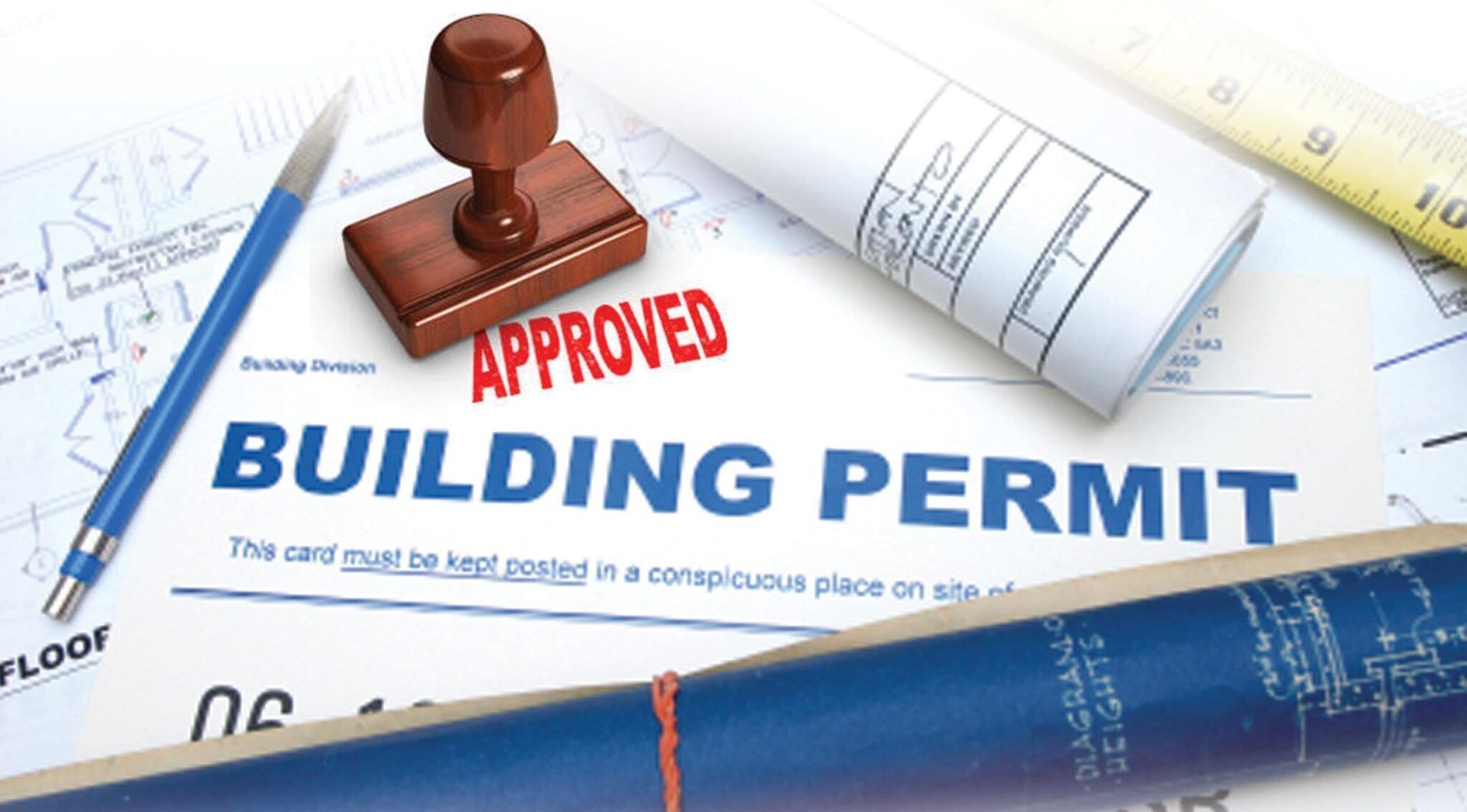 A building permit with a stamp on top of it