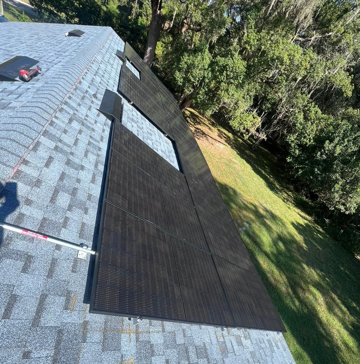 A roof with a lot of solar panels on it.