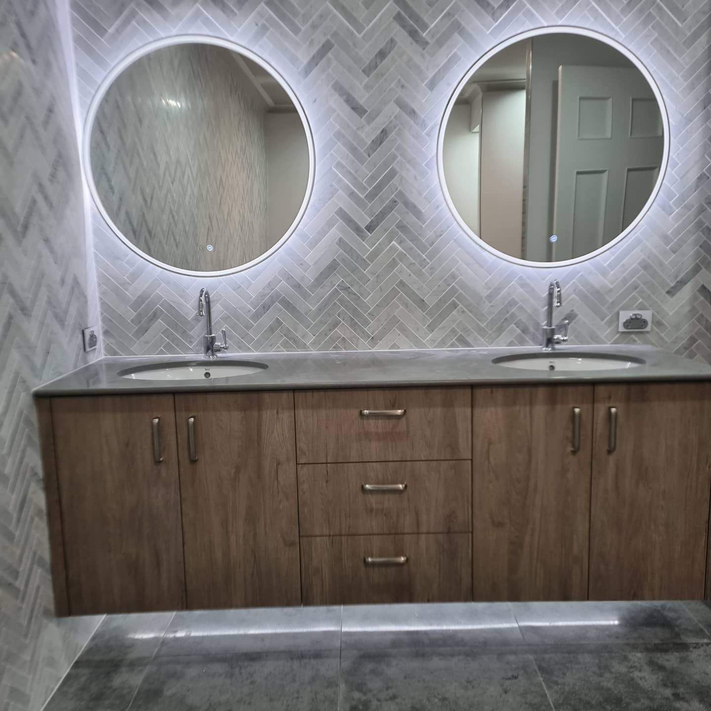 A Bathroom with Two Sinks and Two Mirrors — Goldspark GC Electrical in Burleigh Waters, QLD