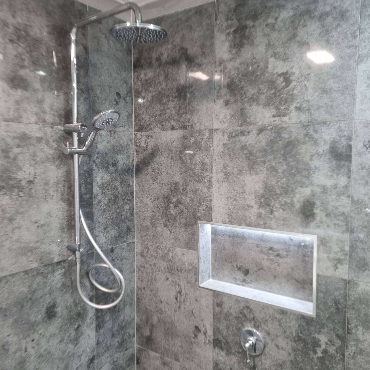 A Shower with A Glass Door and A Shower Head — Goldspark GC Electrical in Burleigh Waters, QLD