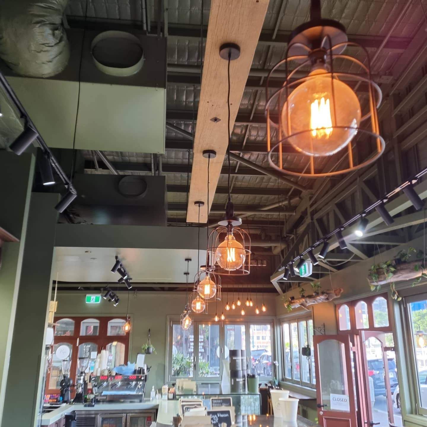 A Restaurant with Lots of Lights Hanging from The Ceiling — Goldspark GC Electrical in Bundall, QLD
