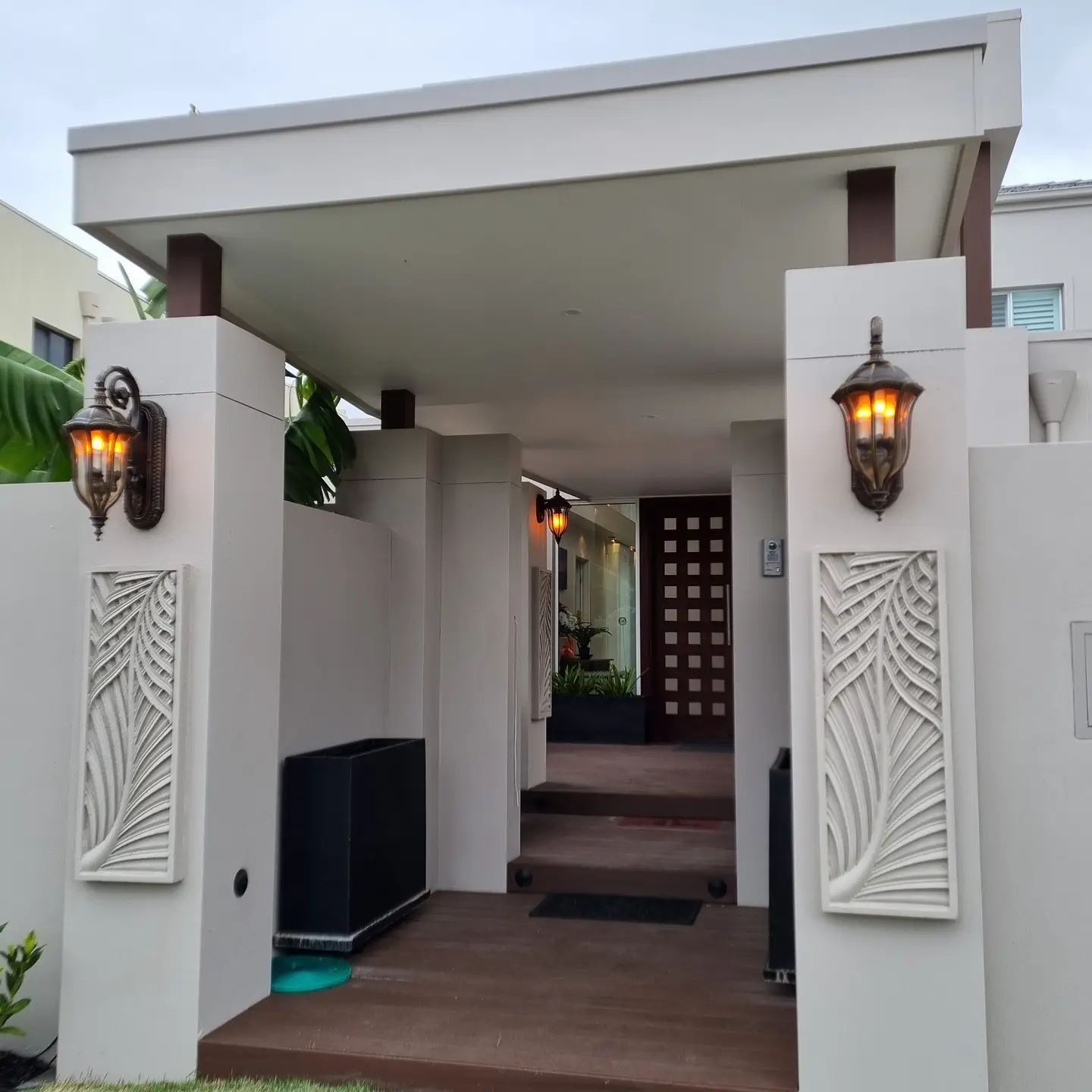The Entrance to A House with Two Lanterns on The Wall — Goldspark GC Electrical in Southport, QLD