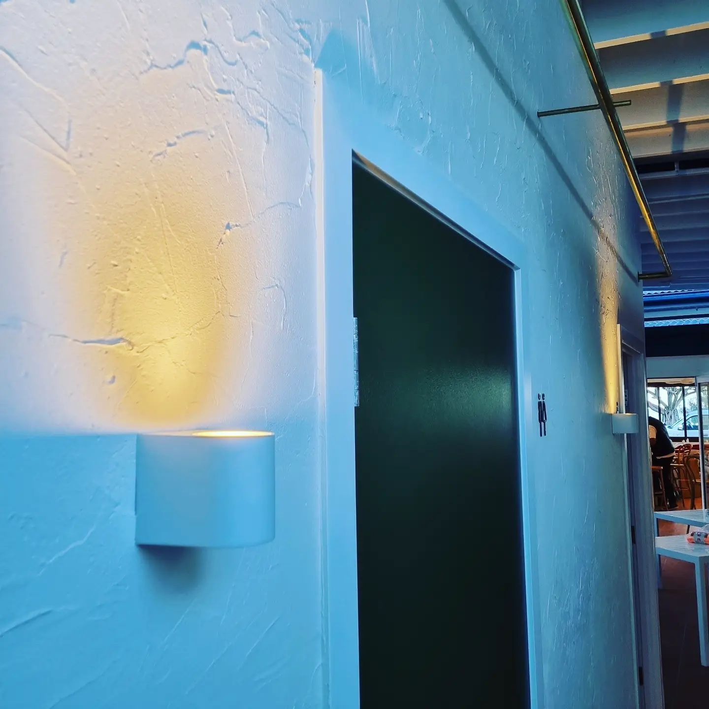 A Hallway with A Door and A Light on The Wall — Goldspark GC Electrical in Burleigh Waters, QLD