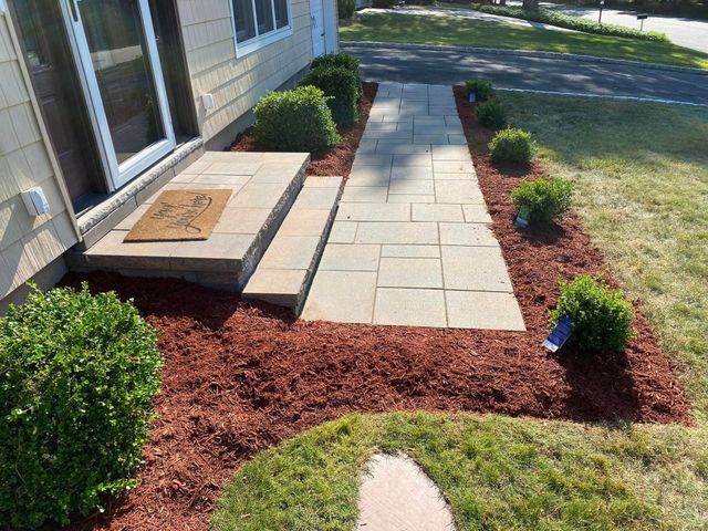 A walkway leading to the front door of a house