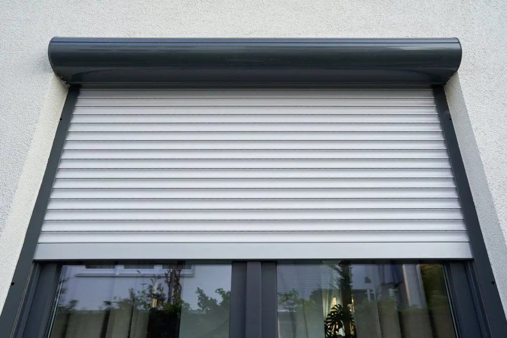 A Close up Of a Window with A Roller Shutter on It — Manning Valley Patios in Nabiac, NSW