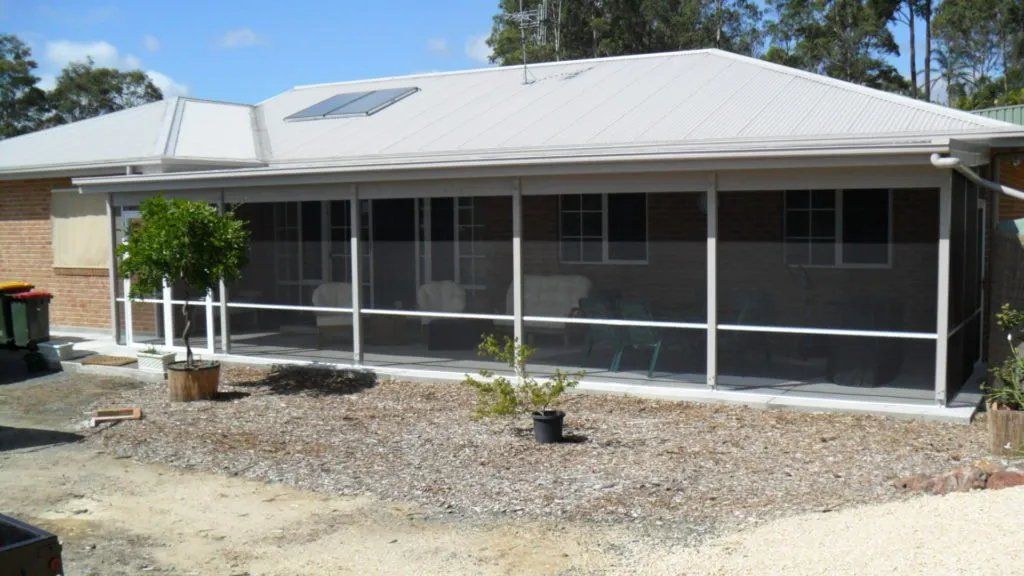 A House with A Screened in Porch in Front of It — Manning Valley Patios in Cundletown, NSW