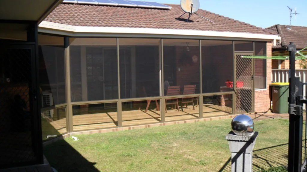 A Screened in Porch with A Satellite Dish on The Roof — Manning Valley Patios in Cundletown, NSW