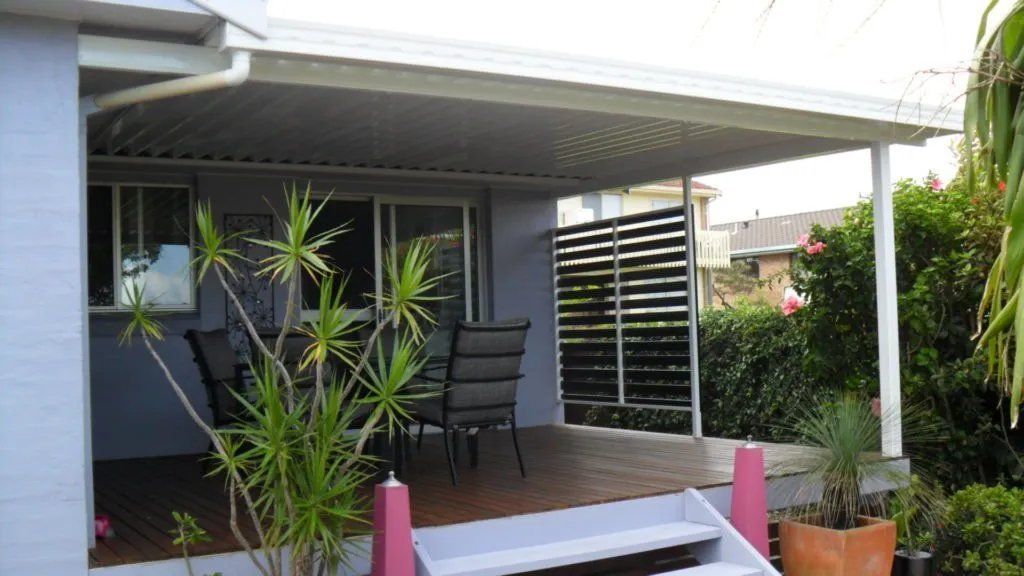 A House with A Porch with Chairs and A Table — Manning Valley Patios in Cundletown, NSW
