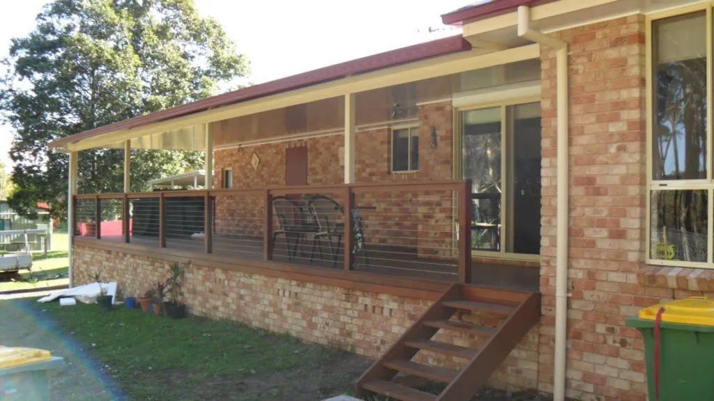 A Brick House with A Large Porch and Stairs — Manning Valley Patios in Cundletown, NSW