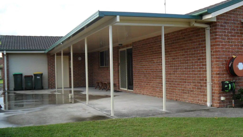A Brick House with A Covered Patio in Front of It — Manning Valley Patios in Cundletown, NSW