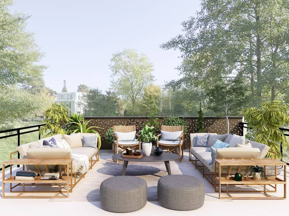 A Balcony with A Lot of Furniture and Trees in The Background — Manning Valley Patios in Cundletown, NSW