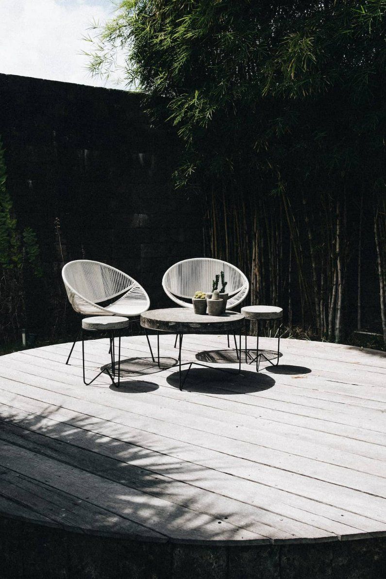 A Wooden Deck with Chairs and Tables on It — Manning Valley Patios in Nabiac, NSW