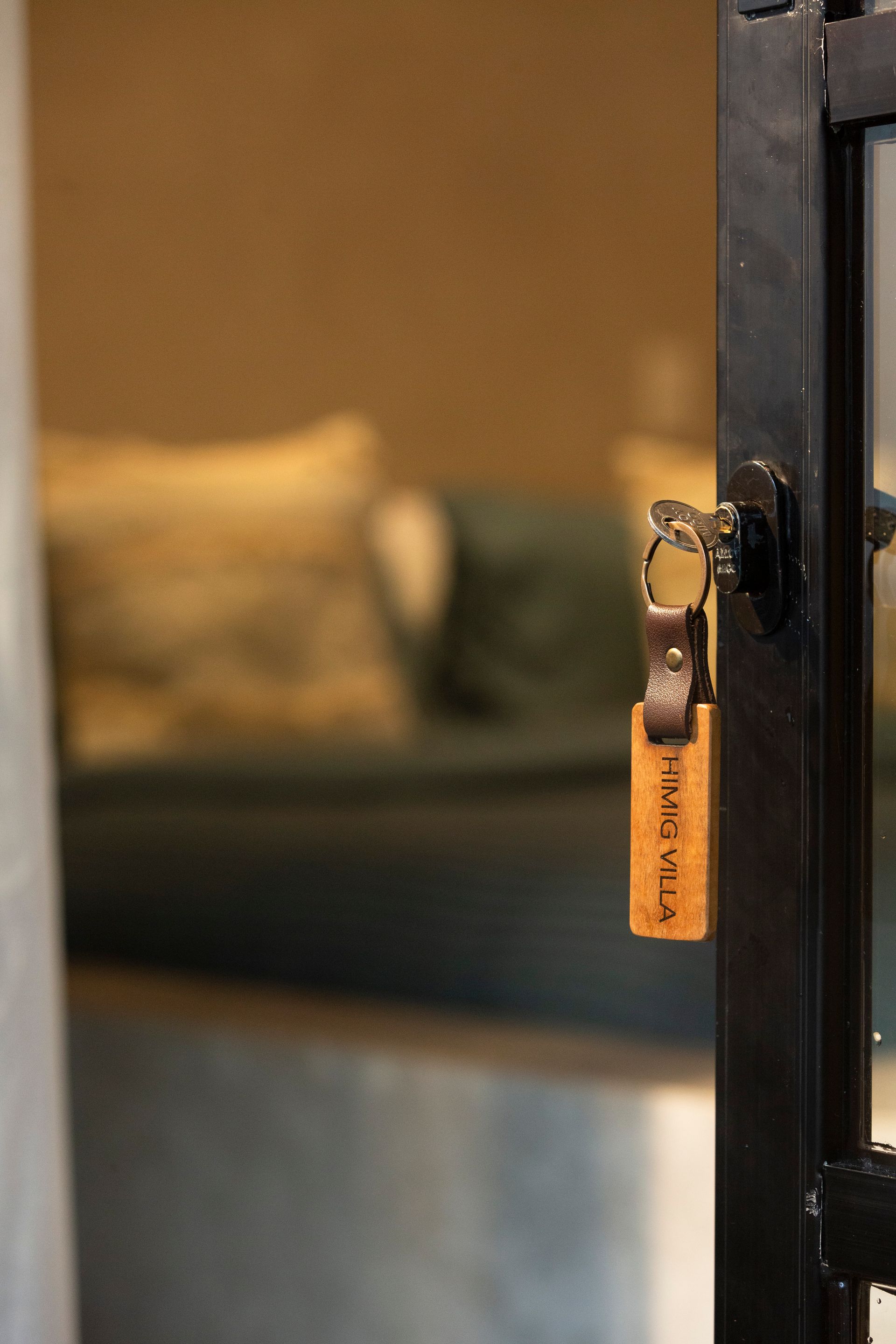 Key in door, wooden tag reads