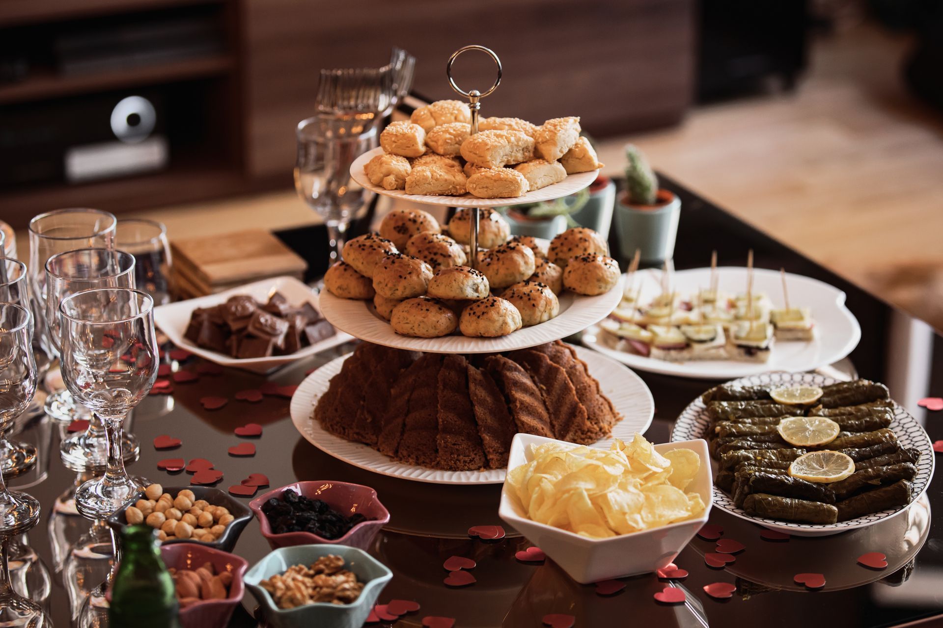 Dessert buffet with tiered trays of pastries, cookies, and sweets on a banquet table