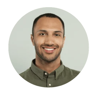 Smiling man in a green shirt.