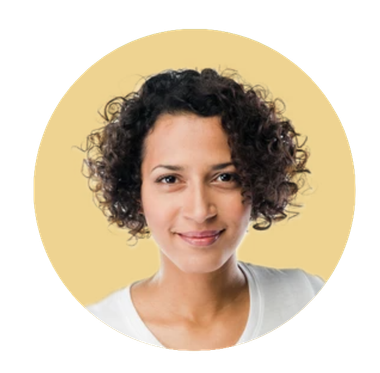 Woman with curly dark hair, smiling, against a yellow circular background.