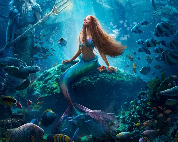 Mermaid on a rock in a glowing underwater scene, with a trident-bearing sea figure and fish around her