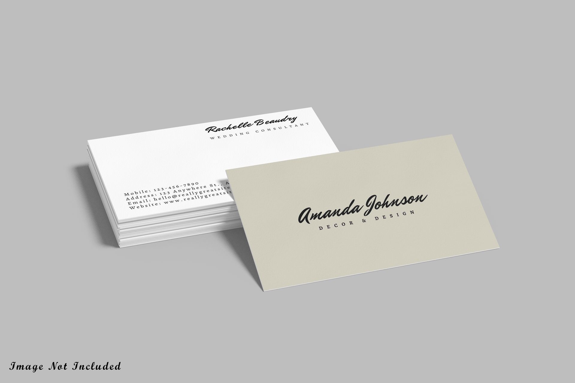 Stack of white business cards and one tan business card on a gray background. Card reads 