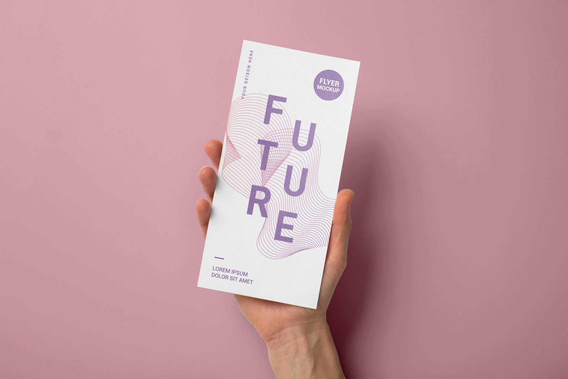 Hand holding a white brochure with the word 