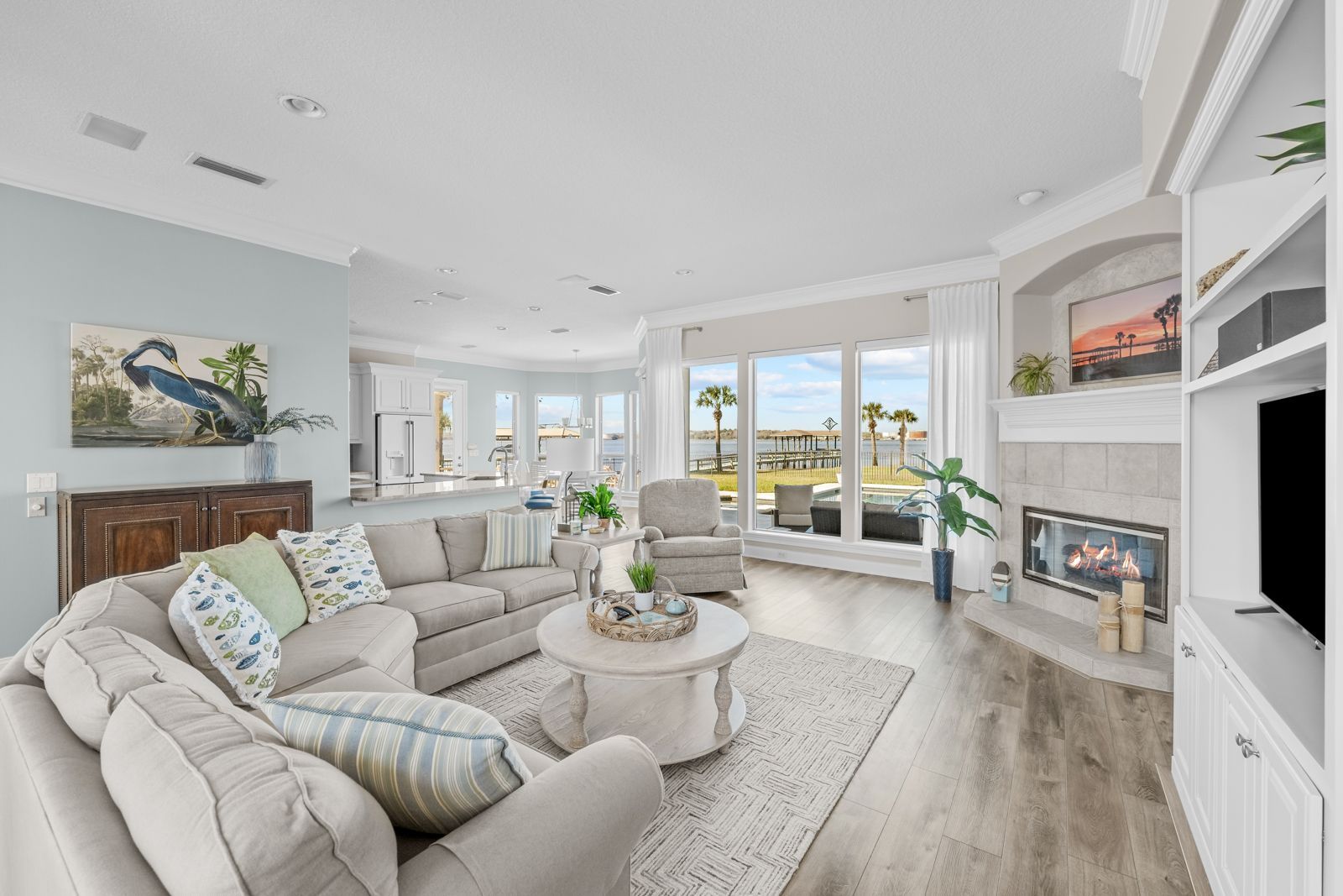 A living room filled with furniture and a fireplace.