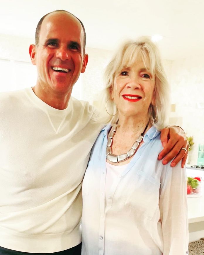 A man and a woman are posing for a picture together